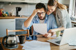 © Geber86 - Stressed young couple doing financials in the kitchen