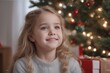 portrait of little girl in santa claus hat looking at camera. happy little girl at christmas portrait of little girl in santa claus hat looking at camera. happy little girl at christmas cute little gi
