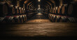 empty dark wooden tabletop for product display on blurred winery wine barrels cellar background