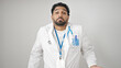 © Krakenimages.com - African american man doctor standing clueless over isolated white background