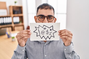 Canvas Print - Middle east man with beard holding banner with swear words smiling and laughing hard out loud because funny crazy joke.