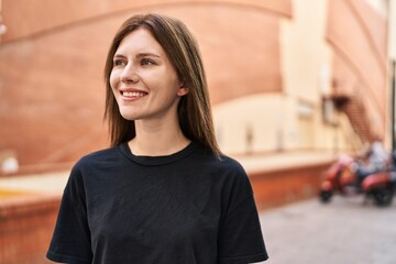 Sticker - Young blonde woman smiling confident looking to the side at street