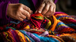Close up of hands of an elderly woman knitting with colorful wool yarn