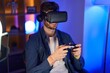 © Krakenimages.com - Young caucasian man streamer playing video game using virtual reality glasses and joystick at gaming room