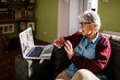 © Marko Geber - Senior Caucasian woman consulting her doctor on a video call on the laptop at home