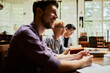 © Marko Geber - Diverse group of young students attending a lecture in the university library