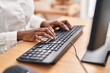 © Krakenimages.com - African american woman using computer keyboard at office