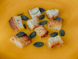 Fototapeta  - Pumpkin soup with croutons and pumpkin seeds