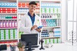 © Krakenimages.com - Young hispanic man pharmacist using touchpad working at pharmacy