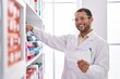 © Krakenimages.com - Young man pharmacist organize shelving reading shelving at pharmacy