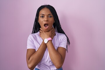 Sticker - African american woman with braids standing over pink background shouting suffocate because painful strangle. health problem. asphyxiate and suicide concept.