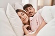 Mand and woman couple lying on bed sleeping at bedroom
