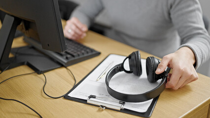 Sticker - Hispanic man holding headphones at office