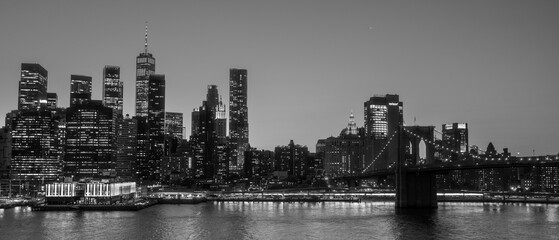 Canvas Print - High-resolution black and white image of a city skyline on a dark night