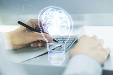 Poster - Creative light bulb illustration with human brain and hand writing in diary on background with laptop, future technology concept. Multiexposure