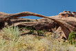 Arches formed from erosion of sandstone. Beautiful scenic image of a natural stone arch located and Arches National Park. Tourist destination of geological formations.