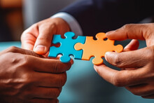 Hand Holding Jigsaw Puzzle. Concept Of Business Partnership And Finding A Solution And Compromise. Business Partners.