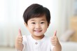 boy showing thumbs up Asian boy with positive attitude