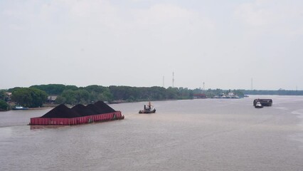 Wall Mural - ships carrying coal