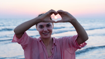 Wall Mural - young woman at the beach , sunset time