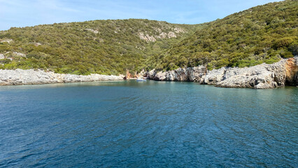 Wall Mural - A clean bay with rocks where tour boats dock between Urla and Sığacık.