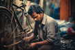 Mastering the Craft: An Expert Indian Bicycle Repairman Skillfully Tends to Two-Wheelers in His Workshop
