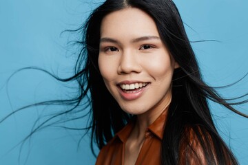 Happy woman smile blue studio asian background