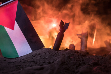 Israel flag on burning dark background with candle. Attack on Israel, mourning for victims concept or Concept of crisis of war and political conflict.