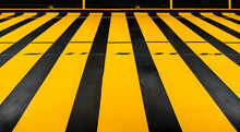 Urban Safety: Abstract Yellow Crosswalk Pattern On City Streets