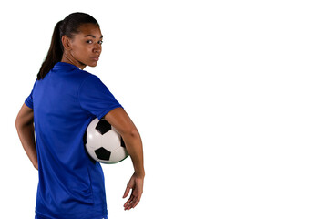 Wall Mural - Digital png photo of serious biracial female footballer with ball on transparent background