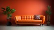 © ND STOCK - Orange tufted leather sofa against smooth wall with copy space. Minimalist home interior design of modern living room.