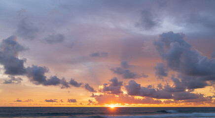Wall Mural - abstract amazing scene of stuning colorful sunset or sunrise with clouds background in nature and tr
