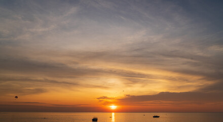 Wall Mural - abstract amazing scene of stuning colorful sunset or sunrise with clouds background in nature and tr