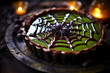 A spooky spiderweb chocolate tart with a gooey green 