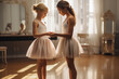 A little girl ballerina receiving guidance and encouragement from her dedicated teacher 