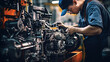 Car mechanic working in auto repair shop. Auto service industry. Automotive manufacturing