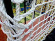a rope cage for children on the pirate-themed playground, a fishing net on the boat. decline in imprisoning naughty women