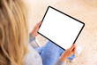 © Kaspars Grinvalds - Woman holding tablet computer in hands, empty white screen mockup