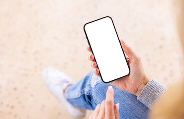 Woman using cell phone, blank white screen mockup