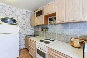 interior apartment kitchen and dining room, refectory area, cooking equipment, table furniture, stove