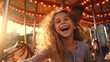 A joyful little girl laughing on a merry-go-round