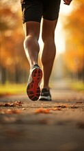 Perspective Of A Man's Legs While Jogging In A Park