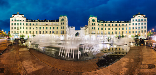 Wall Mural - Munich, Germany - Panoramic view of Karlstor Gate and Karlsplatz Square at night