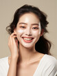 © Mangsaab - Beautiful young asian woman applying facial cream. fresh Healthy Skin, Beauty Cosmetics and Facial treatment.