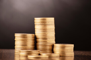 Wall Mural - Closeup of coin pile on table