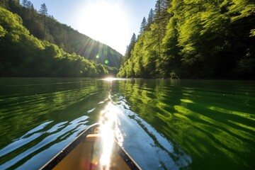 Poster - sun glinting off a green canoe on a glassy river