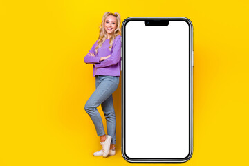 Sticker - Full body photo of attractive young woman folded arms big smartphone placard trendy purple outfit isolated on yellow color background