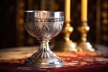 An Ornate Silver Chalice And Paten On An Altar