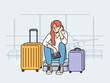 © Dzianis Vasilyeu - Upset woman airport passenger sits among tourist suitcases and waits for plane that is late due to bad weather. Concept of flight cancellation causing inconvenience to airport passengers