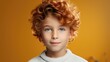 Close up portrait of funny kid boy with red hair and freckles. Boy looking in camera with relaxed and calm face expression